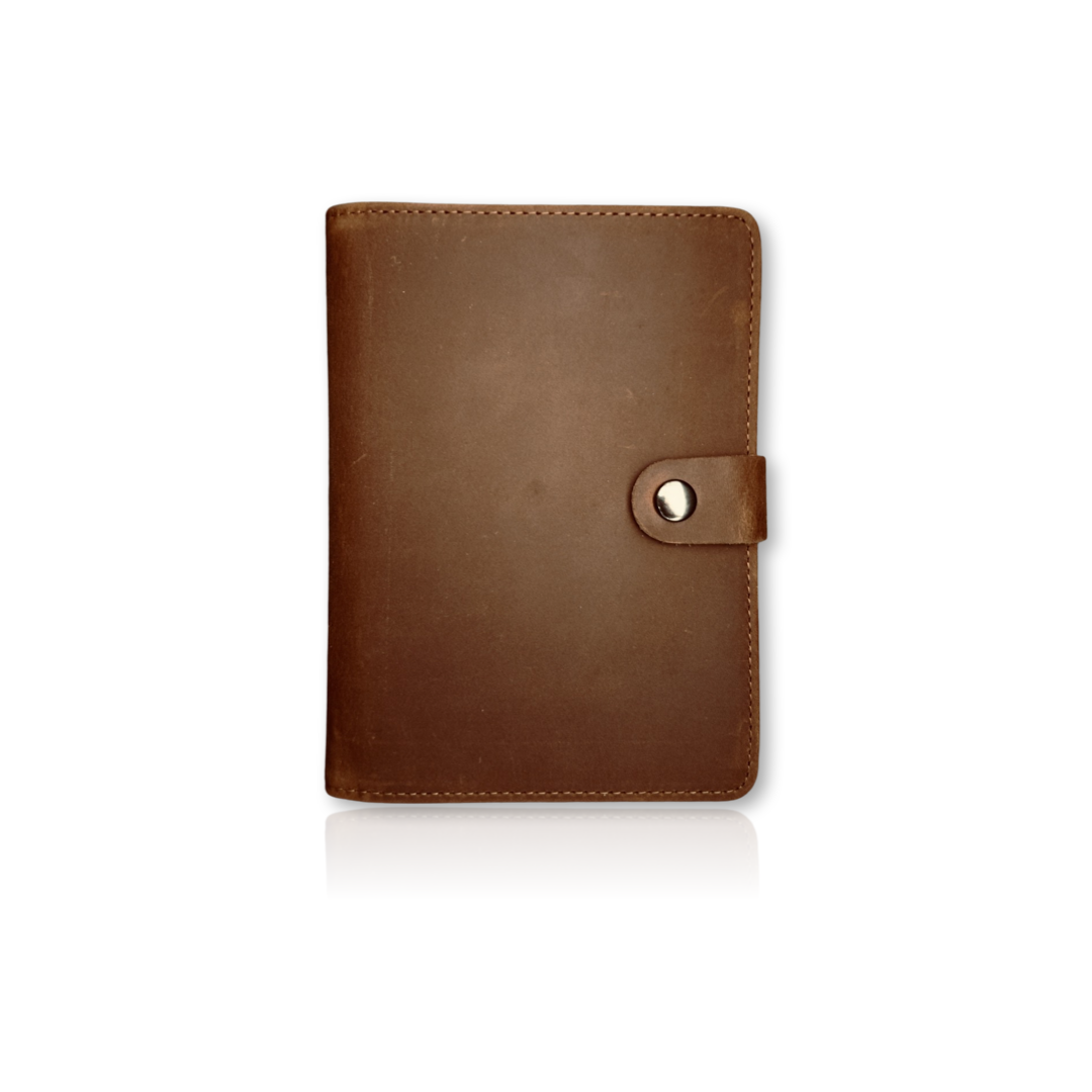 Coffee Individual Airtag Passport Holder made from genuine leather, offering RFID protection and spacious storage for travel essentials