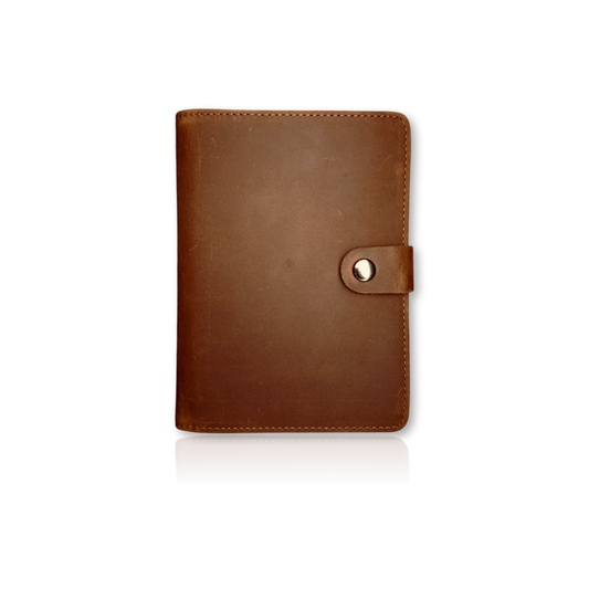 Coffee Individual Airtag Passport Holder made from genuine leather, offering RFID protection and spacious storage for travel essentials